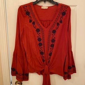 Altar’d State, size S, long sleeve, red blouse w/ blue stitched floral accents.